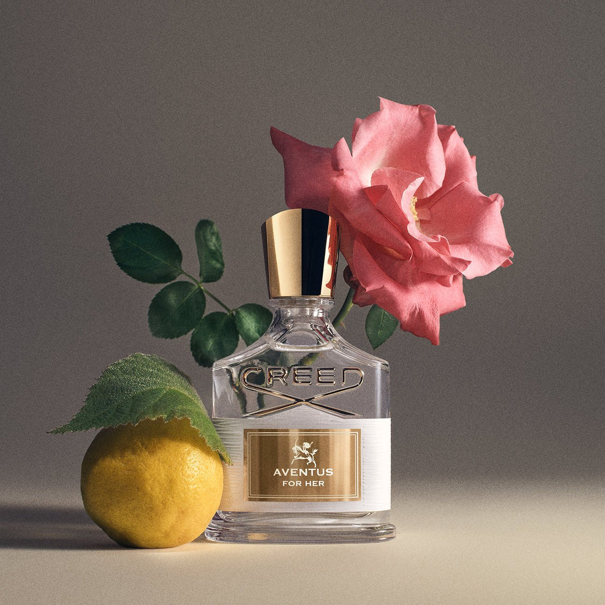 Aventus For Her by Creed, bottle with raw materials