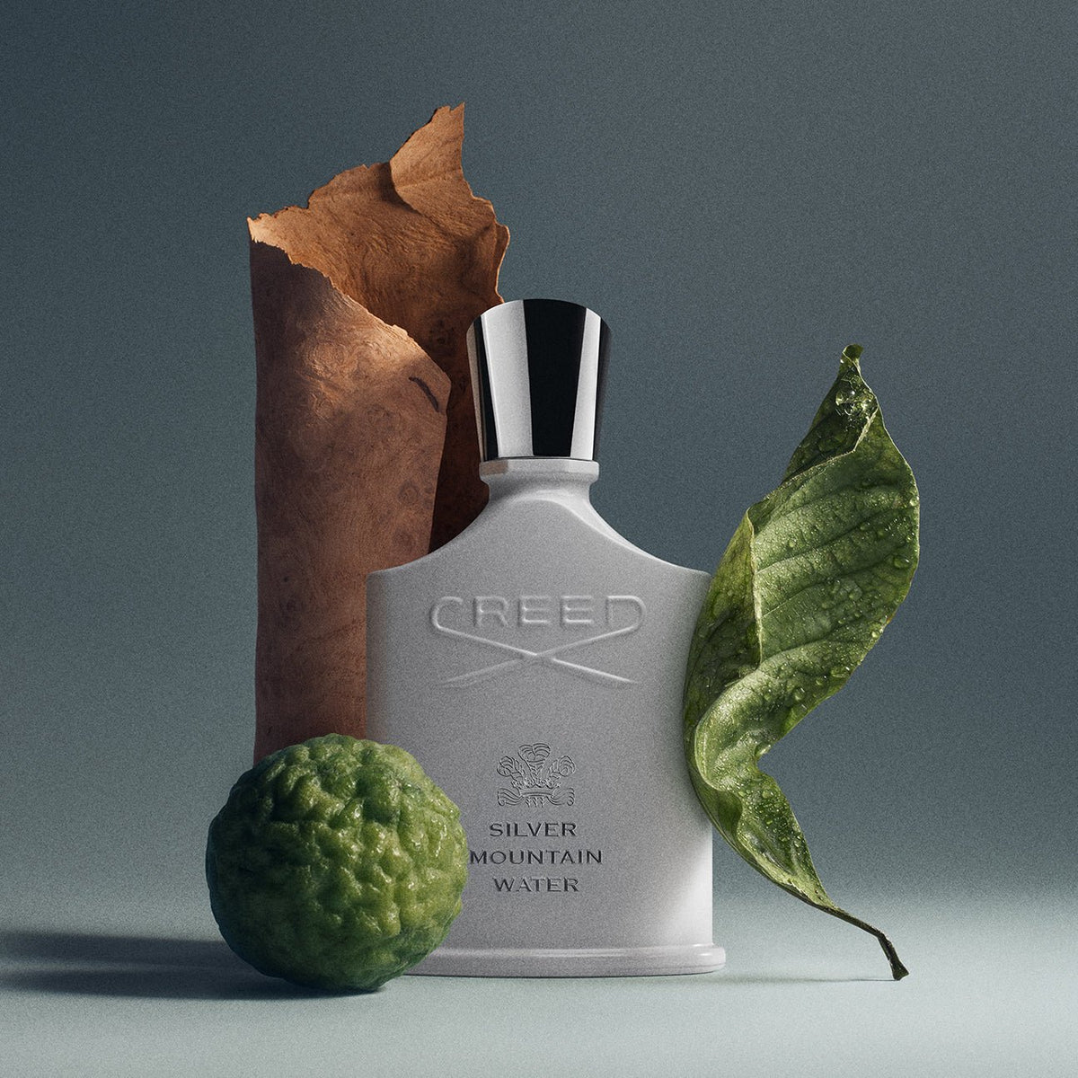 Silver Mountain Water by Creed, bottle with raw materials